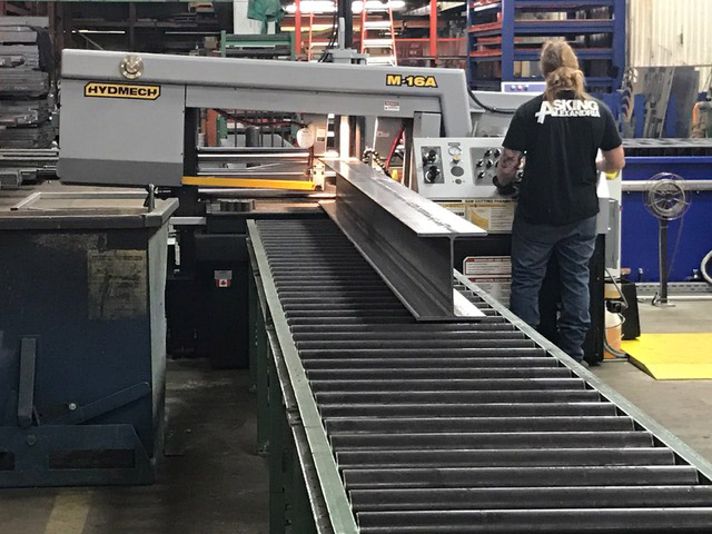 man working using a conveyor belt in a factory